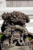 Bangkok Wat Arun - Detail of the precint of the sacred area of the ubosot. guarded by chinese lions. 